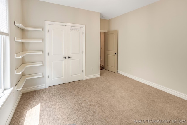1412 E 37th St, Tulsa, OK 74105 - unfurnished bedroom featuring carpet flooring, a closet, and baseboards