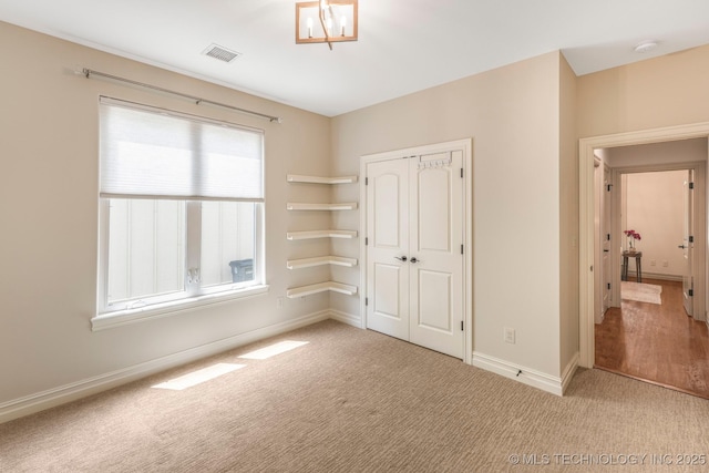 1412 E 37th St, Tulsa, OK 74105 - unfurnished bedroom featuring carpet floors, a closet, and baseboards