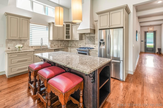 1412 E 37th St, Tulsa, OK 74105 - kitchen with stainless steel appliances, a sink, plenty of natural light, a center island, and a towering ceiling