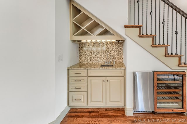 1412 E 37th St, Tulsa, OK 74105 - indoor bar with dark wood-style floors, decorative backsplash, wine cooler, and stairway