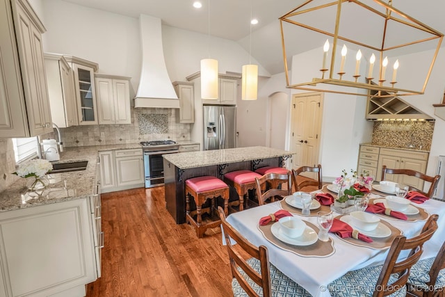 1412 E 37th St, Tulsa, OK 74105 - dining space featuring wood finished floors, lofted ceiling, and recessed lighting