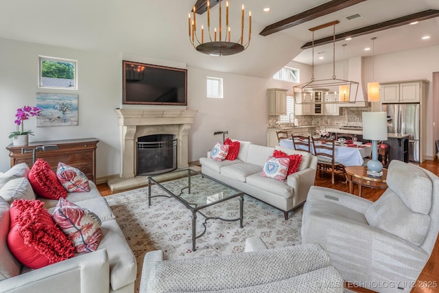 1412 E 37th St, Tulsa, OK 74105 - living room featuring healthy amount of natural light, light wood-type flooring, beam ceiling, a fireplace with raised hearth, and baseboards