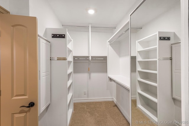 1412 E 37th St, Tulsa, OK 74105 - walk in closet featuring light colored carpet