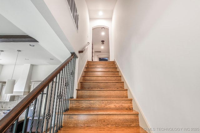 1412 E 37th St, Tulsa, OK 74105 - stairs with a towering ceiling, arched walkways, and recessed lighting
