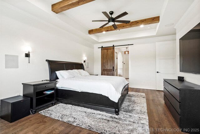 3406 W Quantico Pl, Broken Arrow, OK 74011 - bedroom featuring beamed ceiling, a barn door, dark wood finished floors, a raised ceiling, and a ceiling fan