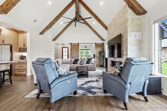 3406 W Quantico Pl, Broken Arrow, OK 74011 - living room featuring beam ceiling, high vaulted ceiling, wood finished floors, ceiling fan, and plenty of natural light