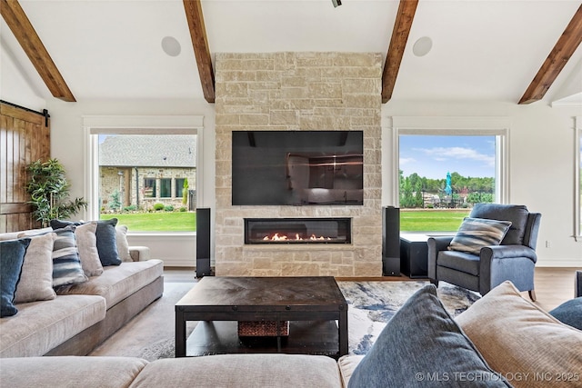 3406 W Quantico Pl, Broken Arrow, OK 74011 - living area with beam ceiling, a fireplace, plenty of natural light, and wood finished floors