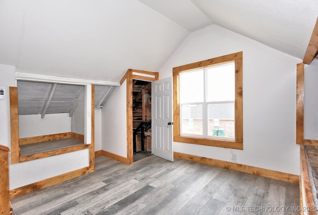 206 S Mounds St, Sapulpa, OK 74066 - unfurnished bedroom with wood finished floors, vaulted ceiling, baseboards, and a closet