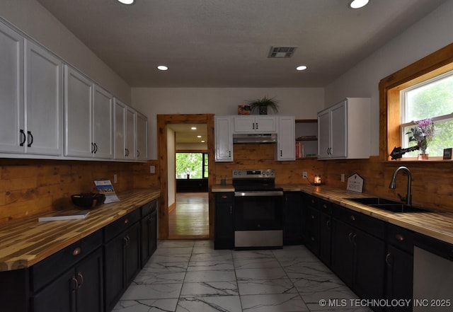 206 S Mounds St, Sapulpa, OK 74066 - kitchen featuring electric range, a sink, under cabinet range hood, white cabinetry, and light marble finish floors