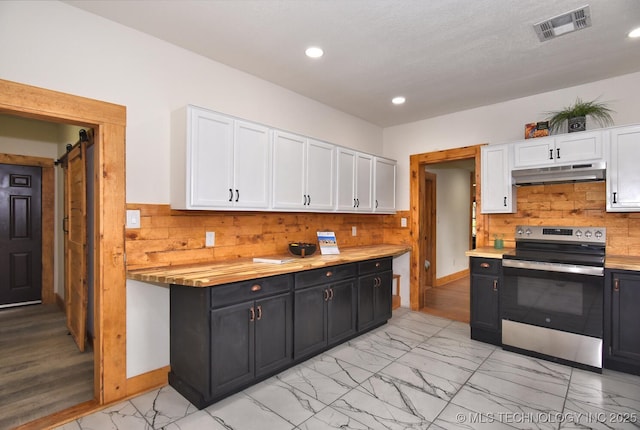 206 S Mounds St, Sapulpa, OK 74066 - kitchen with electric stove, under cabinet range hood, white cabinets, light marble finish flooring, and recessed lighting