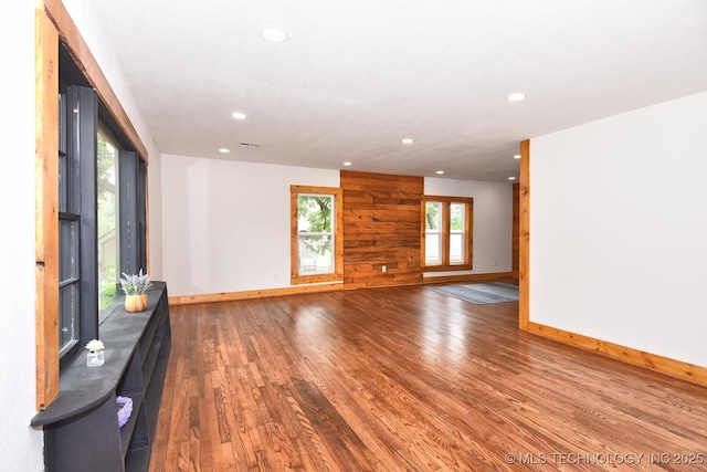 206 S Mounds St, Sapulpa, OK 74066 - unfurnished living room with recessed lighting, baseboards, and wood finished floors