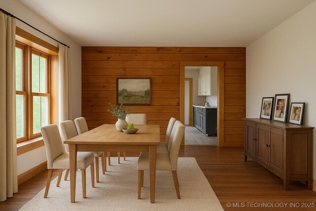206 S Mounds St, Sapulpa, OK 74066 - dining room featuring light wood-type flooring and wood walls