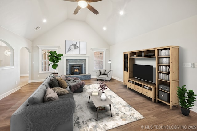 6200 E 340th Rd, Talala, OK 74080 - living area featuring a ceiling fan, wood finished floors, high vaulted ceiling, arched walkways, and recessed lighting
