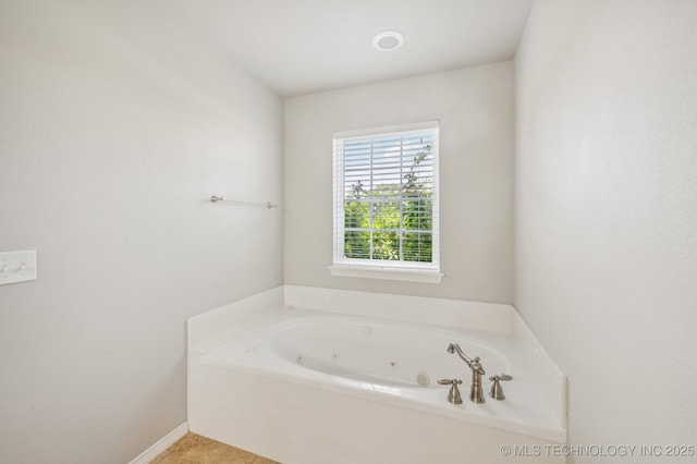 6200 E 340th Rd, Talala, OK 74080 - bathroom with a whirlpool tub and baseboards