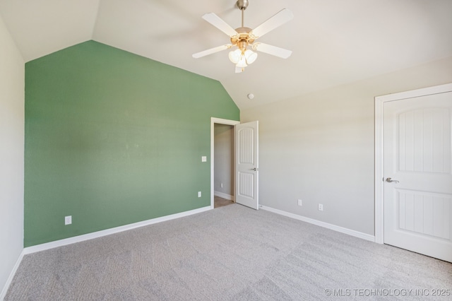6200 E 340th Rd, Talala, OK 74080 - unfurnished bedroom featuring vaulted ceiling, carpet flooring, and ceiling fan