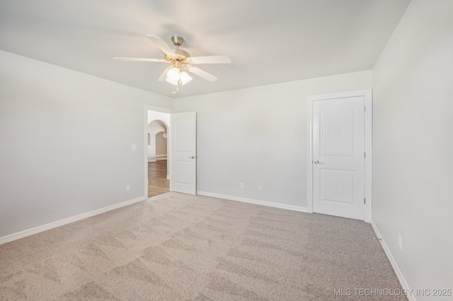 6200 E 340th Rd, Talala, OK 74080 - carpeted empty room featuring arched walkways and a ceiling fan