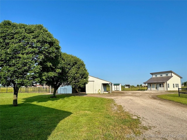 6200 E 340th Rd, Talala, OK 74080 - view of yard featuring an outbuilding, a detached garage, and dirt driveway