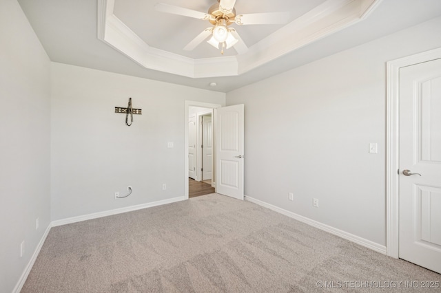 6200 E 340th Rd, Talala, OK 74080 - unfurnished bedroom featuring a raised ceiling, carpet, a ceiling fan, and ornamental molding