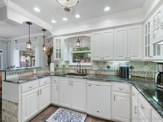 402 Beaumont Dr, Ardmore, OK 73401 - kitchen with dishwasher, a sink, a peninsula, white cabinets, and crown molding