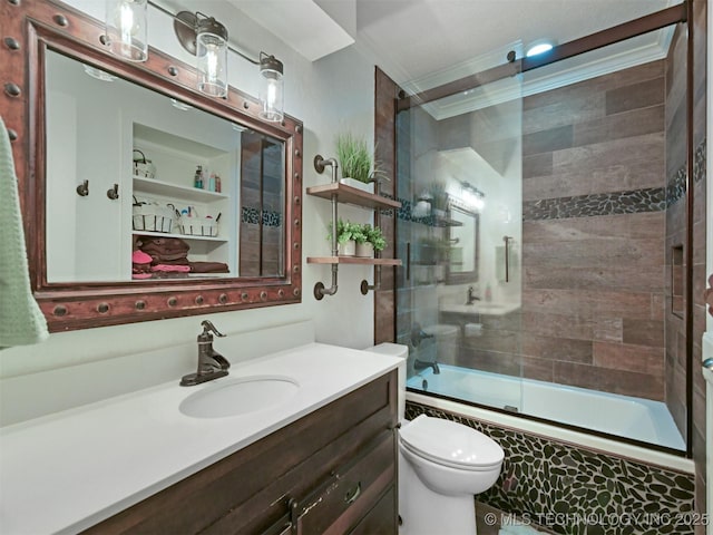 402 Beaumont Dr, Ardmore, OK 73401 - full bath featuring tiled shower / bath, vanity, toilet, and crown molding