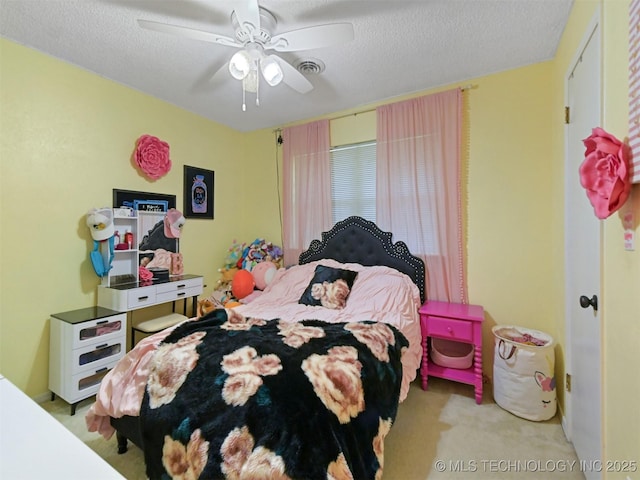 402 Beaumont Dr, Ardmore, OK 73401 - bedroom with carpet flooring, a textured ceiling, and ceiling fan