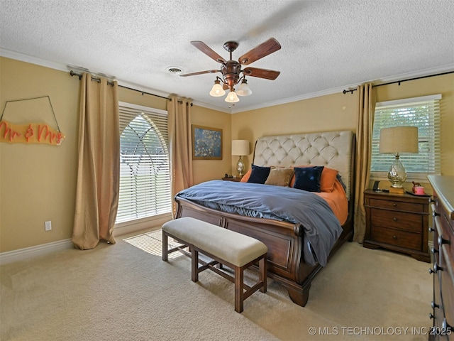 402 Beaumont Dr, Ardmore, OK 73401 - bedroom featuring multiple windows, light colored carpet, a textured ceiling, ornamental molding, and baseboards