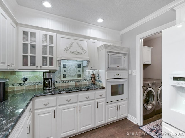 402 Beaumont Dr, Ardmore, OK 73401 - kitchen featuring white appliances, independent washer and dryer, glass insert cabinets, crown molding, and white cabinets