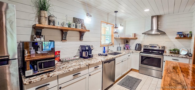 114276 S 4170th Rd, Checotah, OK 74426 - kitchen with stainless steel appliances, open shelves, wall chimney range hood, light stone counters, and a sink