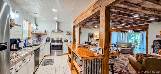 114276 S 4170th Rd, Checotah, OK 74426 - kitchen featuring wall chimney exhaust hood, stainless steel appliances, open shelves, a sink, and light stone countertops