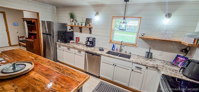 114276 S 4170th Rd, Checotah, OK 74426 - kitchen featuring stainless steel appliances, a sink, open shelves, light stone counters, and pendant lighting