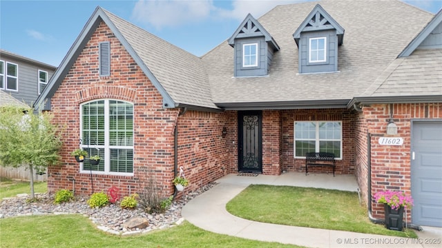 11602 S 30th W Ave, Jenks, OK 74037 - view of front of house with brick siding and a shingled roof
