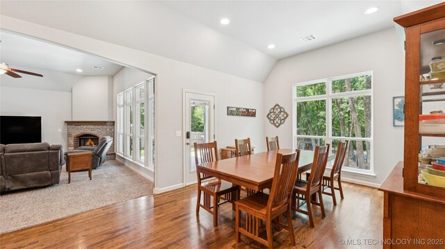 11602 S 30th W Ave, Jenks, OK 74037 - dining room with lofted ceiling, healthy amount of natural light, wood finished floors, a ceiling fan, and recessed lighting