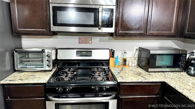 5752 E 147th St S, Bixby, OK 74008 - kitchen with appliances with stainless steel finishes and dark brown cabinets