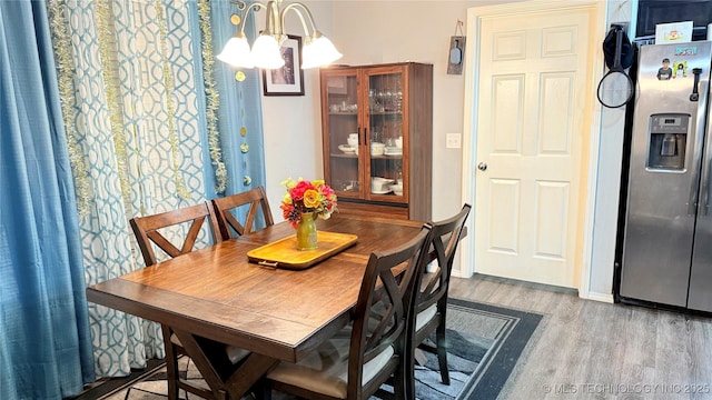 5752 E 147th St S, Bixby, OK 74008 - dining room with wood finished floors and a chandelier