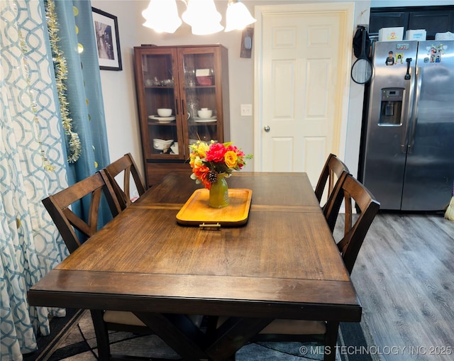 5752 E 147th St S, Bixby, OK 74008 - dining area featuring a chandelier and wood finished floors