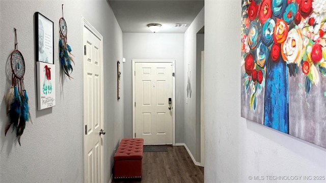 5752 E 147th St S, Bixby, OK 74008 - hallway featuring wood finished floors and baseboards