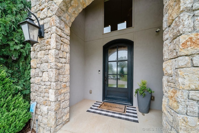 18319 E Red Fox Trl, Owasso, OK 74055 - view of exterior entry featuring stone siding and stucco siding