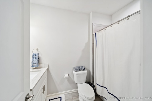 18319 E Red Fox Trl, Owasso, OK 74055 - full bath featuring vanity, toilet, baseboards, and a shower with shower curtain