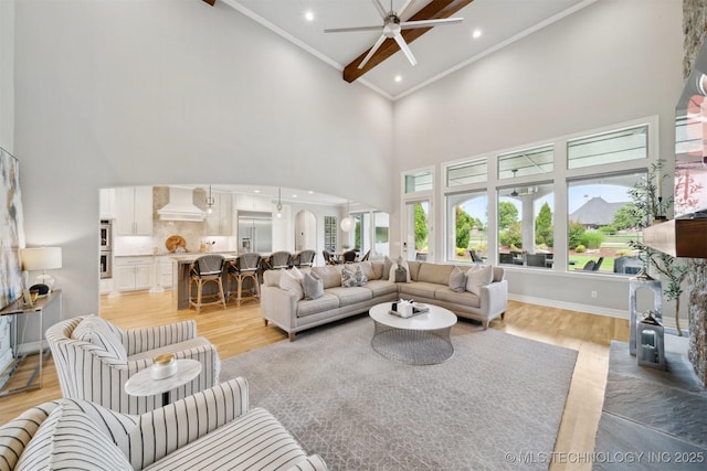 18319 E Red Fox Trl, Owasso, OK 74055 - living area with high vaulted ceiling, light wood-type flooring, ceiling fan, ornamental molding, and recessed lighting