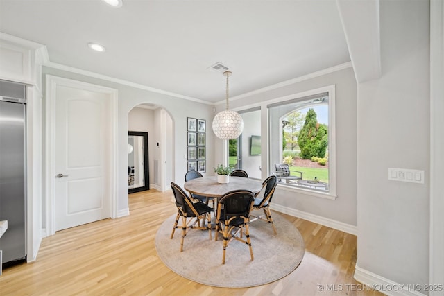 18319 E Red Fox Trl, Owasso, OK 74055 - dining room with arched walkways, light wood-type flooring, baseboards, recessed lighting, and ornamental molding
