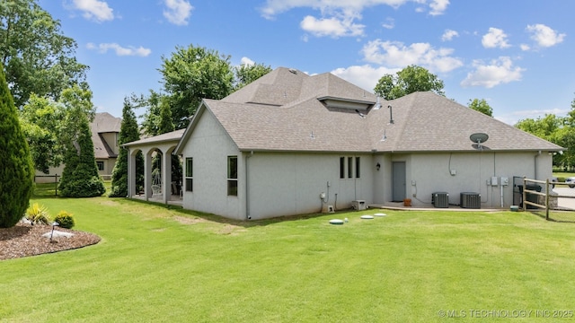 18319 E Red Fox Trl, Owasso, OK 74055 - back of property with a patio area, stucco siding, roof with shingles, and cooling unit