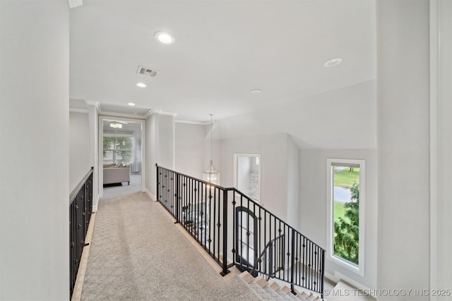 18319 E Red Fox Trl, Owasso, OK 74055 - hallway with an upstairs landing, ornamental molding, baseboards, recessed lighting, and carpet flooring