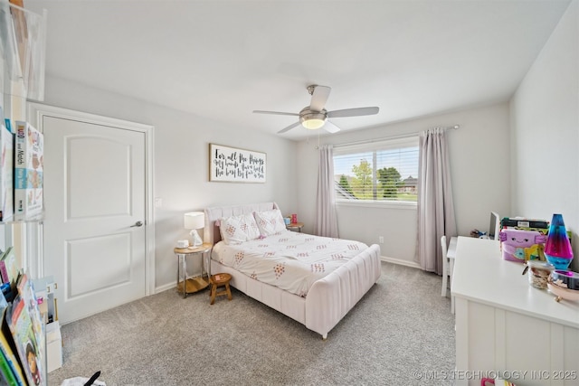 18319 E Red Fox Trl, Owasso, OK 74055 - bedroom with light carpet, baseboards, and ceiling fan