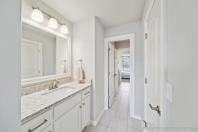 18319 E Red Fox Trl, Owasso, OK 74055 - bathroom featuring tile patterned flooring, vanity, and baseboards