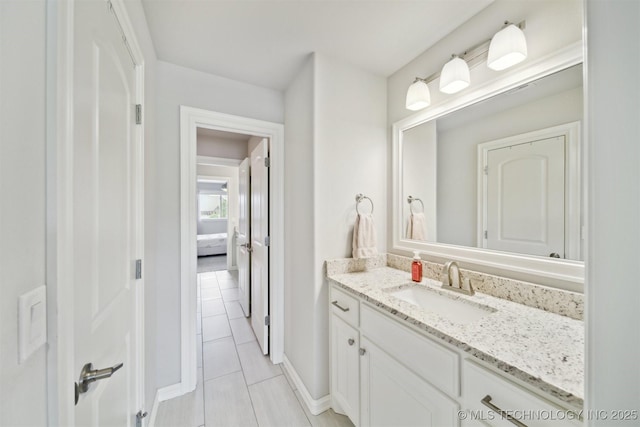 18319 E Red Fox Trl, Owasso, OK 74055 - bathroom featuring vanity, tile patterned floors, and baseboards