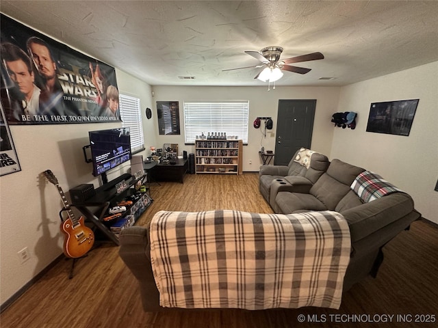 206 I St NE, Ardmore, OK 73401 - living area featuring wood finished floors, ceiling fan, and baseboards