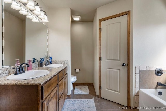 233 Murray Pl, Mannford, OK 74044 - full bath with double vanity, toilet, a bath, and tile patterned floors