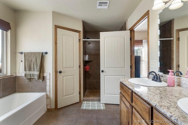 233 Murray Pl, Mannford, OK 74044 - full bath featuring tile patterned flooring, a shower stall, a garden tub, and double vanity