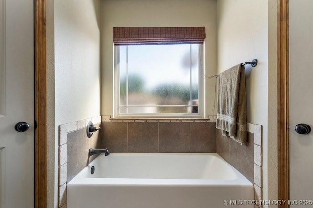 233 Murray Pl, Mannford, OK 74044 - full bathroom featuring a bath and a textured wall