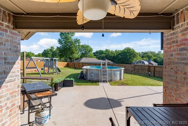 233 Murray Pl, Mannford, OK 74044 - view of patio / terrace with a playground and a grill